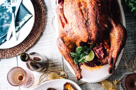 A festive Thanksgiving dinner with friends and family gathered around a table filled with delicious food.