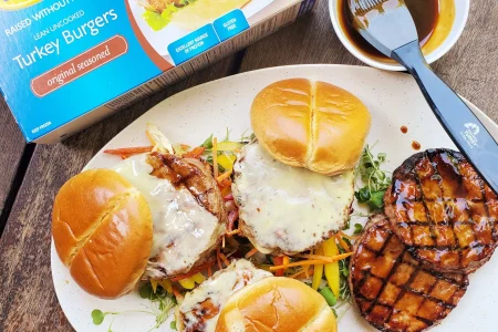 Teriyaki-Turkey-Burgers-scaled Teriyaki turkey burgers with melted cheese, salad and BBQ sauce.