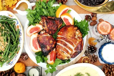Miso-Turkey A table with a variety of food, including a turkey, displayed on it.