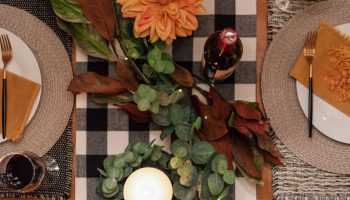 Top view of holiday dinner table with wine Top view of holiday dinner table by candlelight