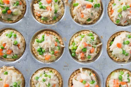 mini-turkey-pot-pies-scaled Mini turkey pot pies with peas, mashed potatoes and carrots.