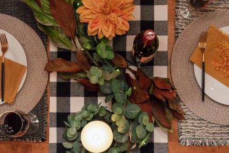 MicrosoftTeams-image-149-1-scaled A table set with a black and white checkered tablecloth, creating a classic and elegant ambiance.